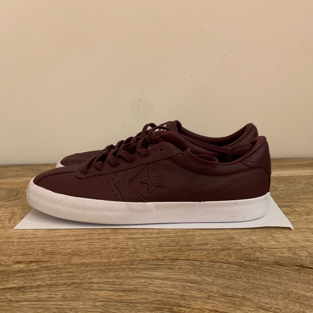Maroon leather converse